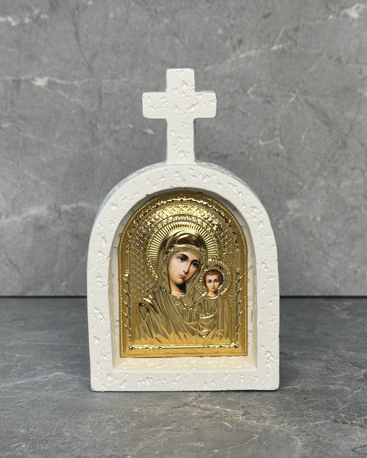White stone Catholic cross icon with gold Panagia Kazan icon of Mother Mary