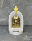 White stone Catholic candle altar with gold Panagia Kazan icon of Mother Mary and Jesus