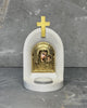 White stone Catholic candle altar with gold Panagia Kazan icon of Mother Mary and Jesus