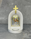 White stone Catholic candle altar with silver Panagia Kazan icon of Mother Mary and Jesus