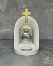 White stone candle altar with Sacred Heart of Jesus icon