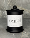 Ombre soy wax candle in a black glass jar with domed lid